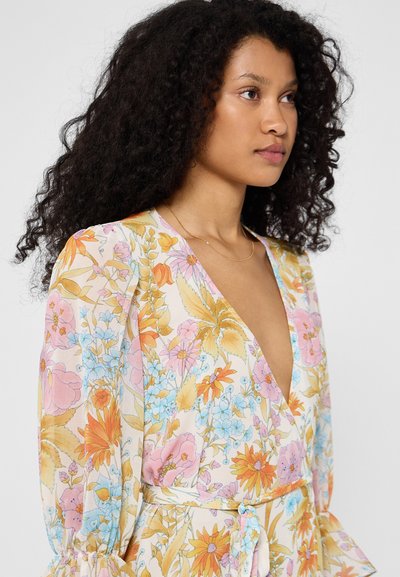 Floral dress in lightweight, flowing fabric featuring a deep V-neck, puffed sleeves, and a belted waist. Colors include pink, blue, and orange.