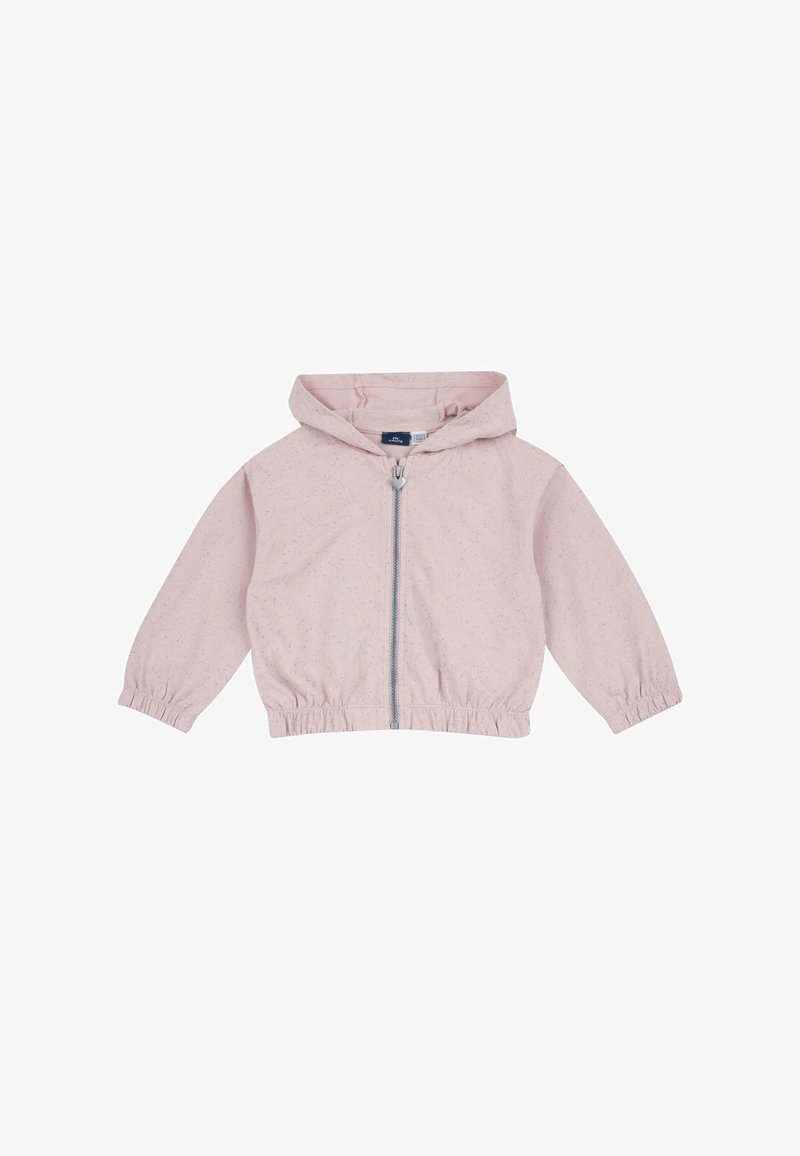 Veste zippée rose clair avec capuche, poignets élastiques et ceinture élastique, présentant une texture légèrement mouchetée sur un tissu doux.