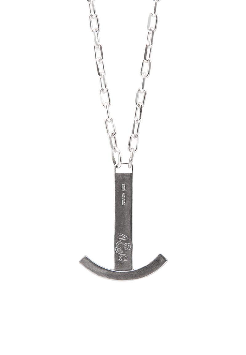 Silver metal necklace featuring a horizontal bar pendant with a curved bottom. Chain link design with a polished texture and engraved detail.