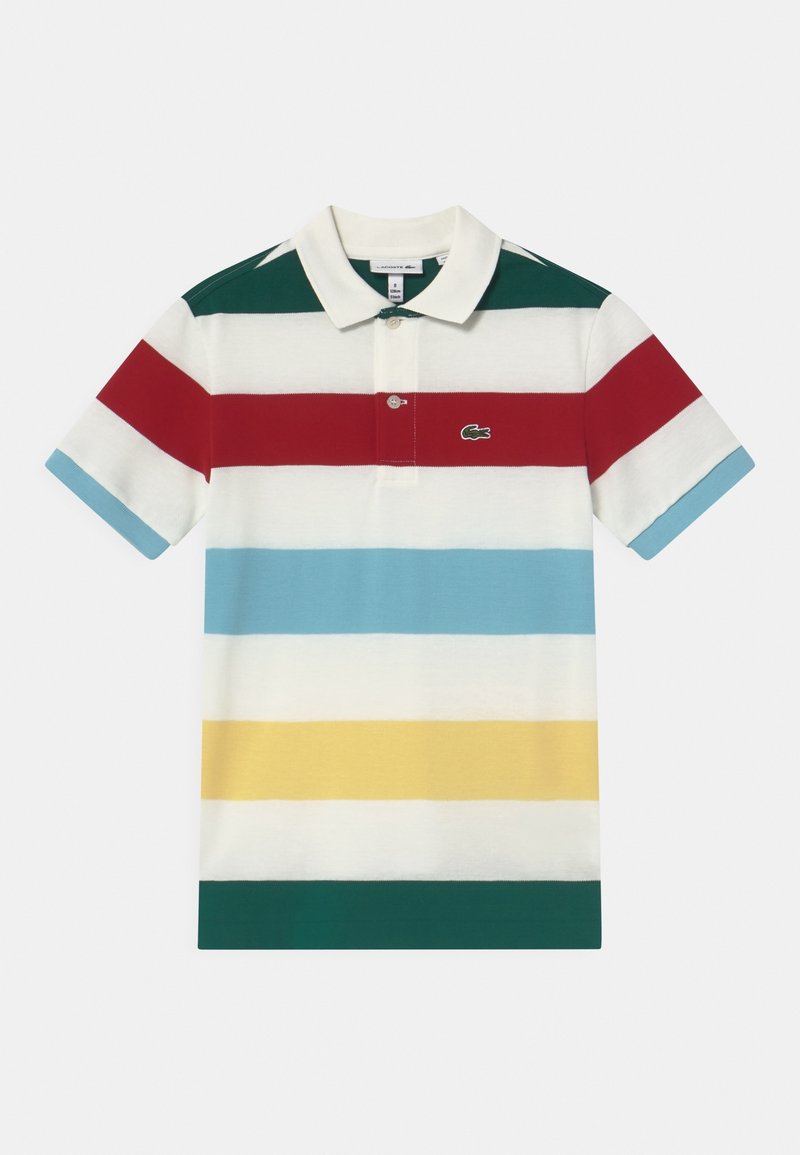 Pikétröja med horisontella ränder i röd, grön, ljusblå, vit, gul och med Lacoste-logotyp. Har krage och tvåknappsrad.