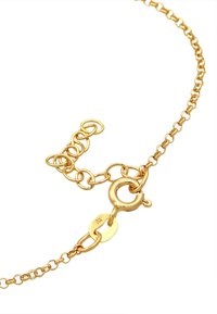 Guldtonad kedja halsband som har länkade ovala och runda former, med en karbinhake och en justerbar längd.