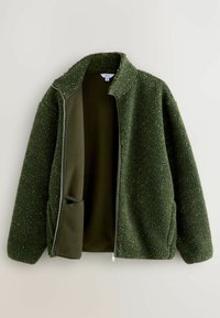 Green fleece jacket with a textured exterior, smooth inner lining, stand collar, and zip closure. Features side pockets and a relaxed fit.