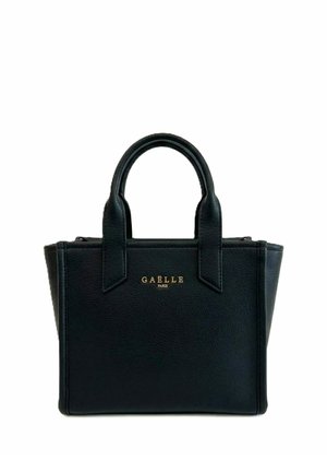 Borsa a mano in pelle nera testurizzata con due manici e logo in oro "Gaëlle Paris" centrato sul pannello frontale su sfondo bianco.