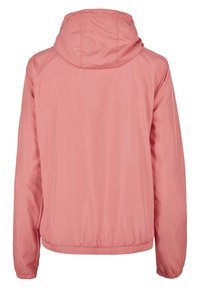 Blød rosa hættejakke med elastiske manchetter og kant, vist bagfra, lavet af let, glat stof.