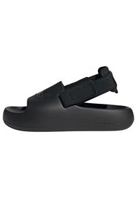 Black sandal with an open toe design, elastic strap, and textured material. Features a molded shape and logo detail on the side.