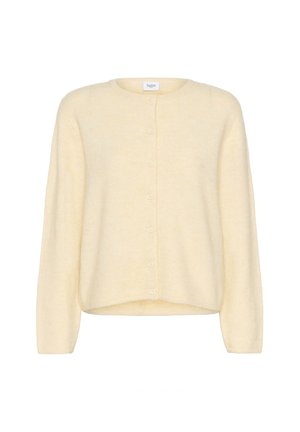 Kreminės spalvos megztinis, pagamintas iš minkštos medžiagos. Turi ilgomis rankovėmis, apvaliu kaklu ir priekyje užsegamą mygtuką su subtilia tekstūra.