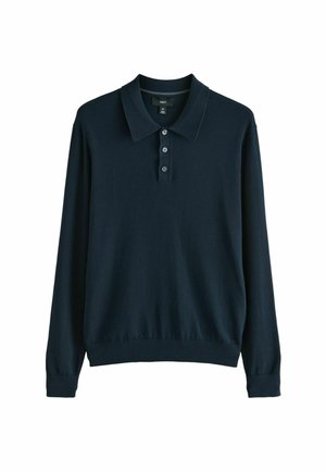 Mornarsko modra polo jopica z dolgimi rokavi, klasičnim ovratnikom, zapenjanjem na tri gumbe ter rebrastimi zapestji in robom. Mehak, teksturiran material.