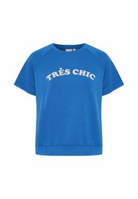 Modrá bavlněná trička s krátkými raglánovými rukávy a kulatým výstřihem. Na přední straně se nachází bílý text "TRÈS CHIC".