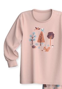 Light pink long-sleeve shirt with a round neckline. Features animal and tree graphics in blue, orange, and brown. Soft fabric texture.