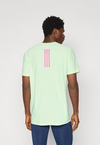 adidas Performance BER25 TEE - Sport T-Shirt - semi green spark