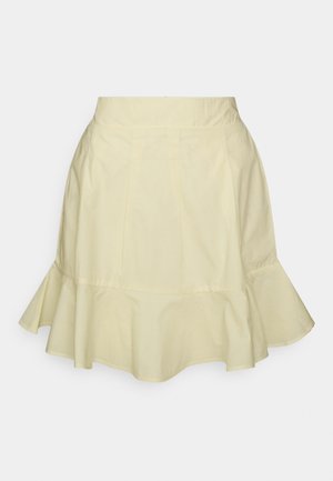 Saia gangada amarela clara feita de algodão. Apresenta uma cintura justa, pregas e uma bainha com volante para uma forma volumosa. Textura suave.