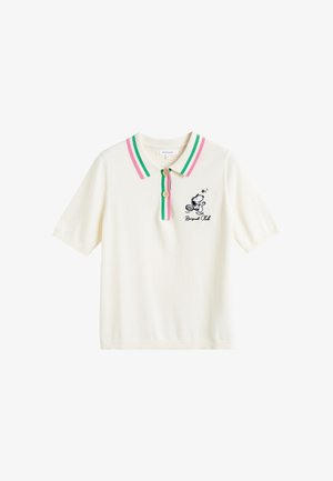 Korte mouwen polo shirt in crème met een roze en groene gestreepte kraag, voorzien van een Snoopy cartoonafbeelding en twee houten knopen.
