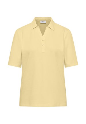 Beżowa koszulka polo z krótkim rękawem, kołnierzykiem, dwoma guzikami i dekoltem w kształcie litery V, z metką "Cecil" wewnątrz kołnierza.