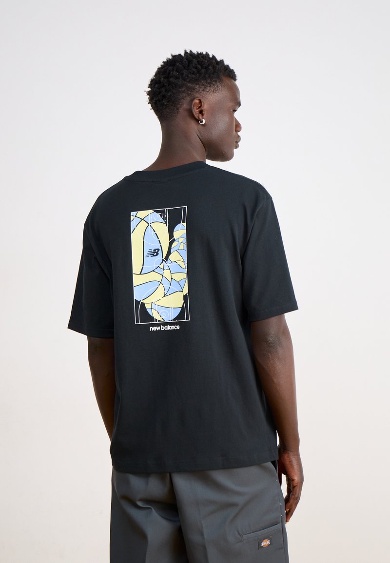 Black cotton t-shirt featuring a colorful graphic print on the back in blue and yellow, with a relaxed fit and short sleeves.