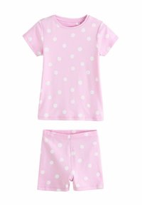 Ensemble de pyjama en coton rose comprenant un haut à manches courtes et un short, tous deux avec des pois blancs, texture lisse et coupe décontractée.