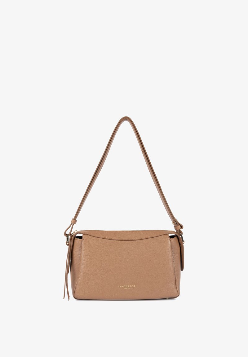 Tan leather shoulder bag with a structured design, rounded edges, top zipper closure, and a single adjustable strap. Gold logo detail on front.