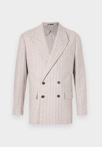 Double-breasted blazer in light beige linen with subtle pinstripes, featuring wide lapels and dark brown buttons. Two front pockets included.