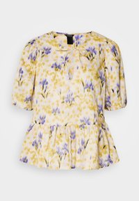 Blumenbluse mit einem Muster aus Gelb, Lila und Pink. Verfügt über Puffärmel, ein Bindeband am Ausschnitt und einen Peplum-Saum. Leichter Stoff.
