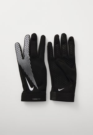 Luvas atléticas pretas com um padrão de textura, design de faixa branca em uma das mãos e acabamentos em relevo. Feitas de um tecido respirável com um ajuste justo.