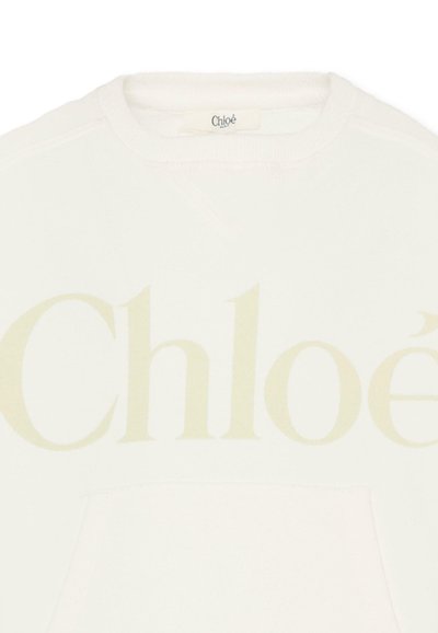 Sweatshirt blanc avec un grand logo "Chloé" beige. Encolure ronde, poignets côtelés et poche avant. Tissu doux et texture lisse.