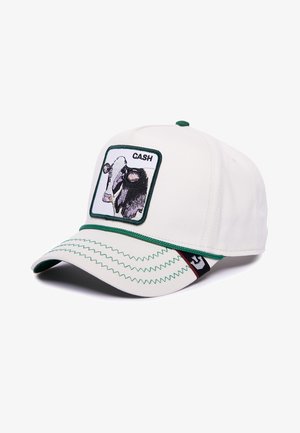 White cap with green accents, featuring a cow graphic patch labeled "CASH" and zigzag stitching on the visor. Cotton material.