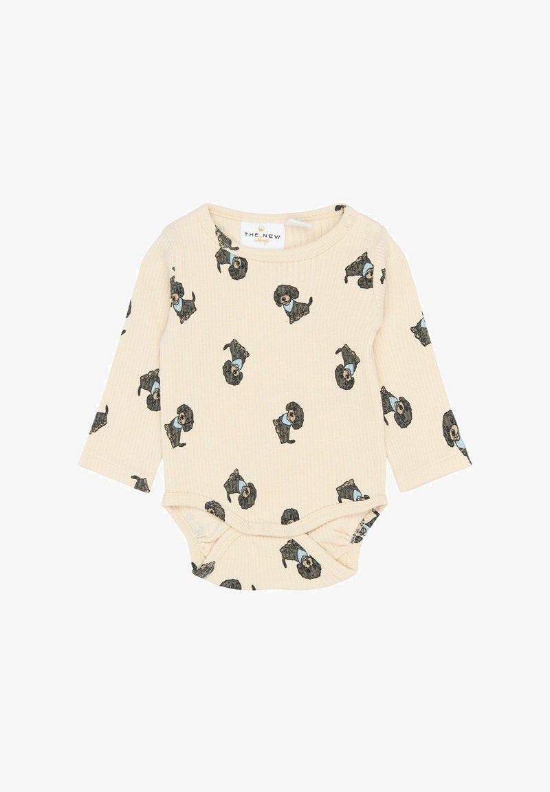 Light beige long-sleeve onesie featuring a repeated dog print, made of ribbed fabric with snap closures at the bottom.