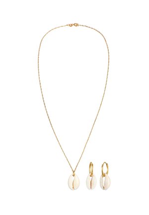 Gold chain necklace with a white cowrie shell pendant and matching earrings. Shells feature a natural texture and detail, enhancing the design.