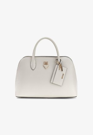 White structured handbag with double handles, gold-tone Guess logo lock, and attached rectangular tag with gold accents.