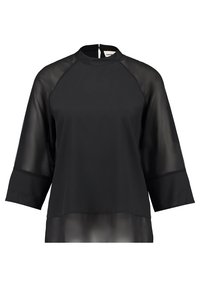 Blouse noire avec manches transparentes trois-quarts, col montant et fermeture éclair au dos. Tissu texturé en design superposé offrant un look contemporain.