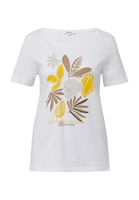 T-shirt blanc à manches courtes avec un imprimé de feuilles et de fleurs colorées en jaune, marron et gris. Le texte indique "LA VIE EST UNE COLLECTION DE SOUVENIRS."