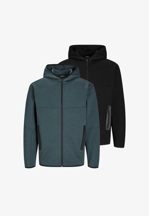 Sweat-shirts à capuche en vert foncé et noir, présentant des poches zippées, une texture lisse et un design sportif avec des inserts contrastants.