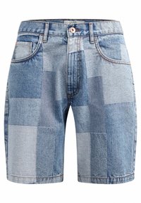 Denim shorts featuring a patchwork design in varying shades of blue, with five-pocket styling and a copper button closure.