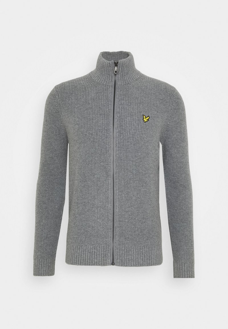 Pull gris côtelé zippé avec col montant et petit logo d’oiseau jaune sur la poitrine gauche.