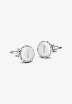 Srebrne spinki do mankietów z okrągłym wzorem, białym emaliowym środkiem z wyrytą literą "I", otoczone koralikowym detalem.
