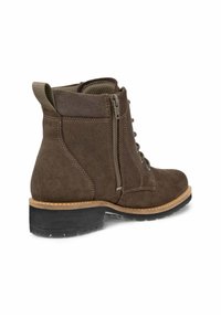 Stivale alla caviglia in suede marrone con cerniera laterale, lacci frontali, punta arrotondata e suola in gomma contrastante con finitura testurizzata.