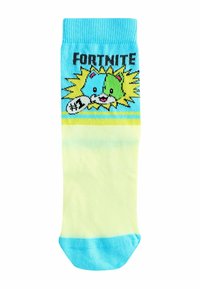 Knee-high sokid heledes kollases ja sinises, millel on koomiksitegelane erksate värvide ja mustritega. Ülaservas on tekst "FORTNITE".