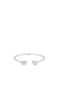 Anillo de plata de ley con un diseño abierto que presenta dos piedras circulares transparentes en cada extremo. Acabado suave, estilo minimalista.