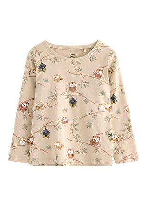 Chemise à manches longues en coton beige clair, avec un imprimé de hibou et de branche d'arbre dans des couleurs douces. Encolure ronde et coupe décontractée.