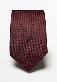 Bourgogne slips med en tekstureret vævning, der har små mønstrede prikker. Den har en klassisk tapered form og en glat overflade.