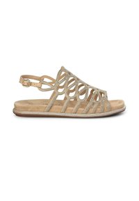 Beige sandaal met een ingewikkeld uitgesneden ontwerp, versierd met glinsterende accenten. Beschikt over een verstelbare enkelriem en een platte zool.