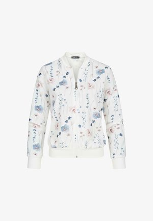 Valge lilleline bomber-jakk, millel on sinine ja roosa lillemuster. Ribitud varrukad ja vöökoht, ees luku külge sulgemisega.