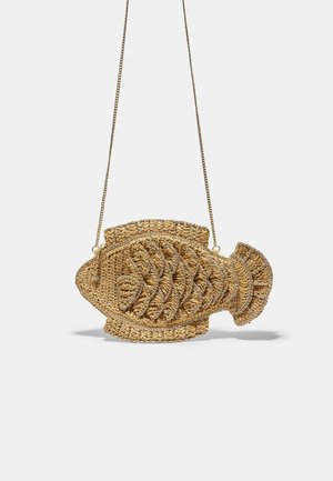 Woven straw handbag shaped like a fish with detailed scales and fins, hanging from a thin gold chain strap.