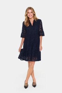Navy blue lace dress with three-quarter flared sleeves, a V-neckline, tiered hem, and intricate floral patterns, paired with black heels.