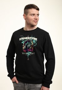 Sudadera negra con un gráfico colorido de auriculares, con el texto "STRAIGHTFIRE" y "TROPICAL TWIST", cuello redondo y mangas largas.