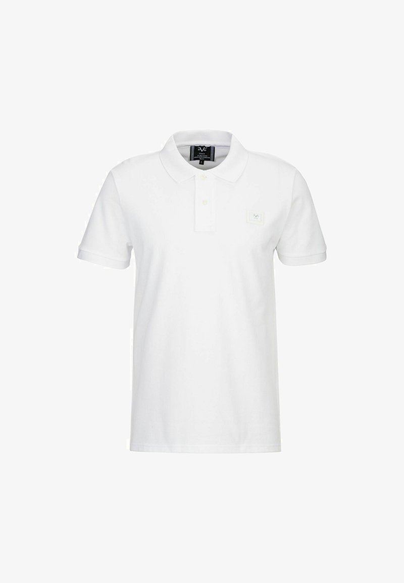 Witte polo shirt gemaakt van katoen, met een klassieke kraag, korte mouwen en een klein geborduurd logo aan de voorkant links.