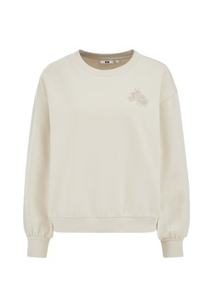Sweat-shirt crème à col rond avec poignets et ourlet côtelés, ornée d'un petit motif floral brodé sur le côté gauche de la poitrine.