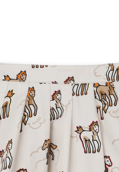 Jupe plissée en coton avec un fond crème, ornée d'illustrations colorées de chevaux en brun et beige, avec des accents rouges et orange.