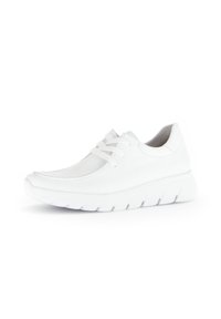 White athletic shoe with a smooth textured upper, lace-up design, rounded toe, and a thick, wavy rubber sole for cushioning.