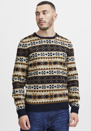 Pulover tricotat în nuanțe de bleumarin, crem și maro, cu modele geometrice și florale. Guler rotund, mâneci lungi și tiv ribonat. Material texturat.