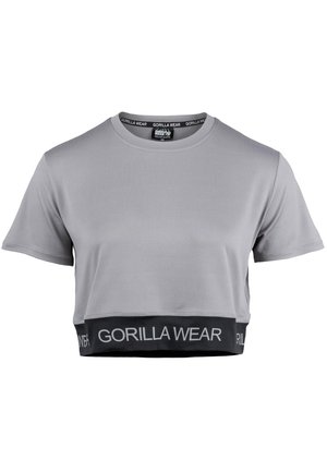 Grijze cropped t-shirt met korte mouwen, een ronde halslijn en een zwarte elastische band aan de onderkant met "GORILLA WEAR" in het wit gedrukt.